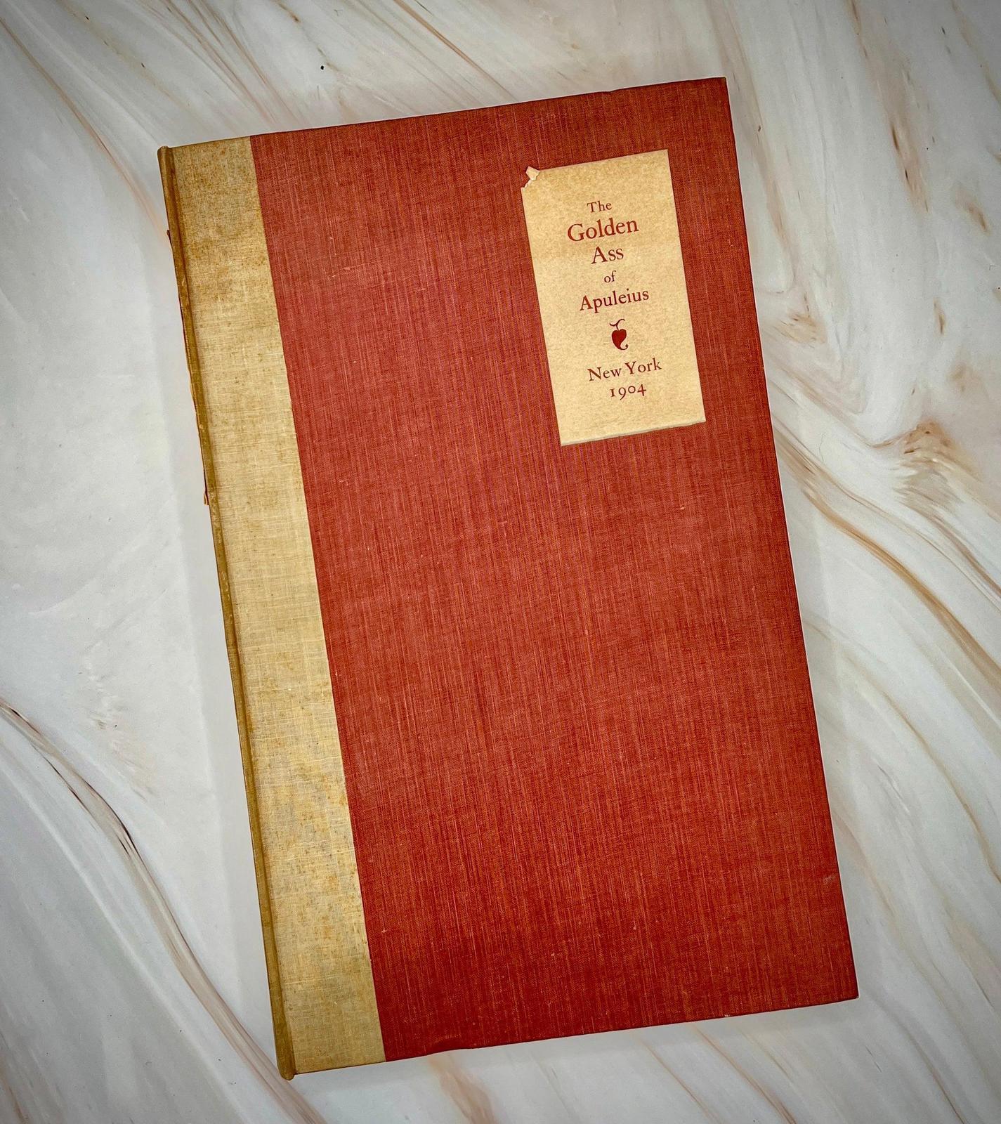 Front cover of the 1904 Chiswick Press edition of The Golden Ass of Apuleius, showing the aged vellum binding.
