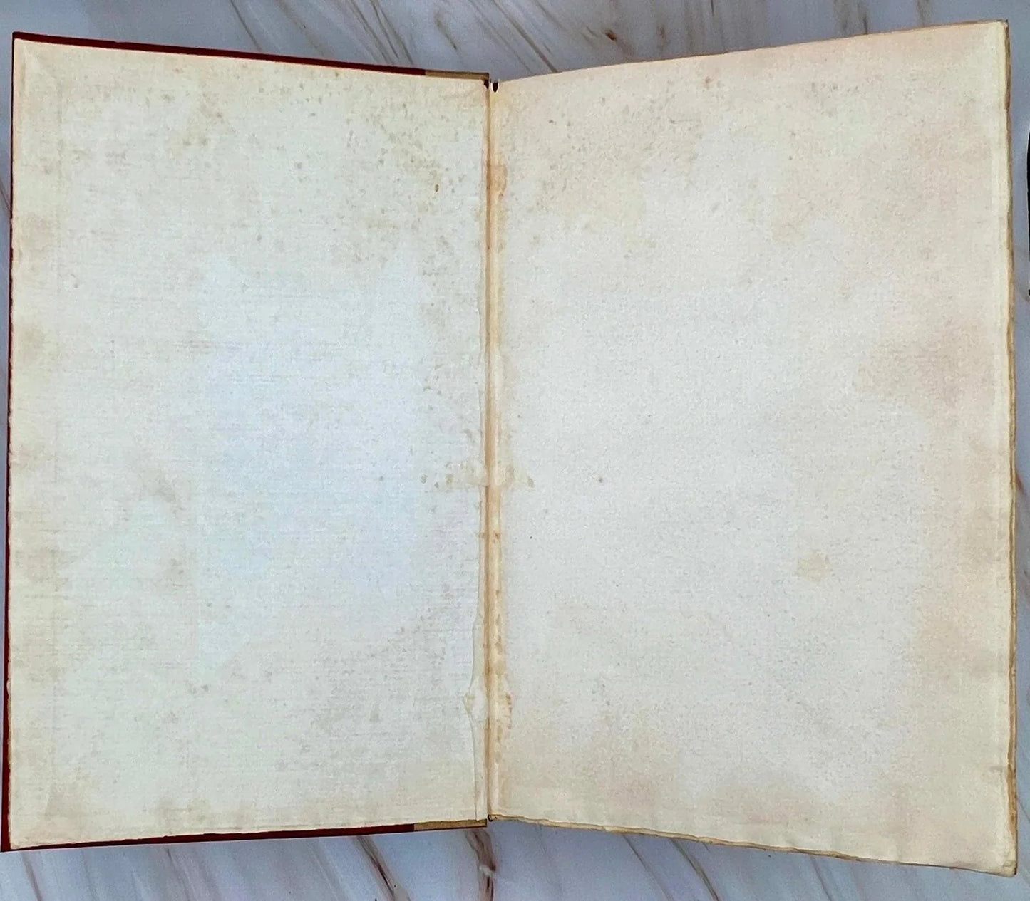 Open book with aged pages on a wooden surface