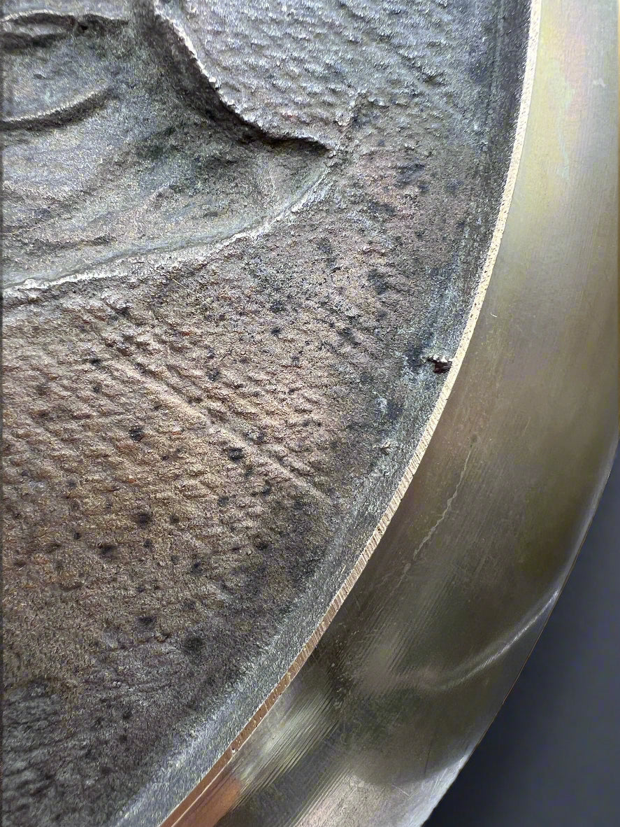 Close-up of a metal surface with a textured pattern