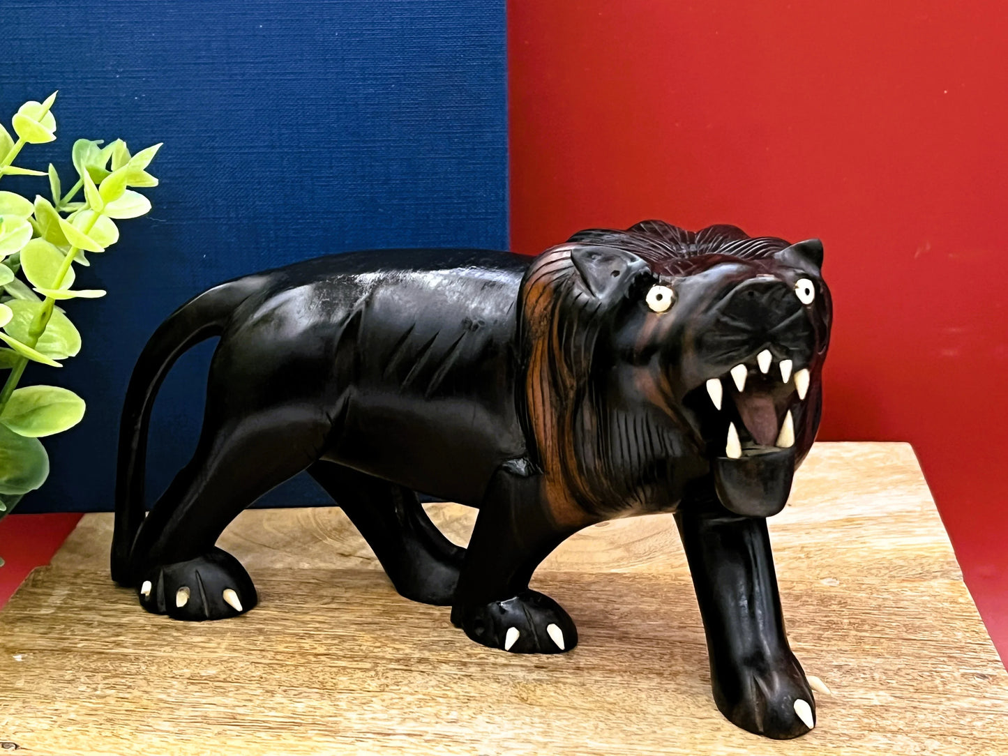 Hand-Carved Ebony Lion Sculpture with Bone Accents 7-Inch Art Decor