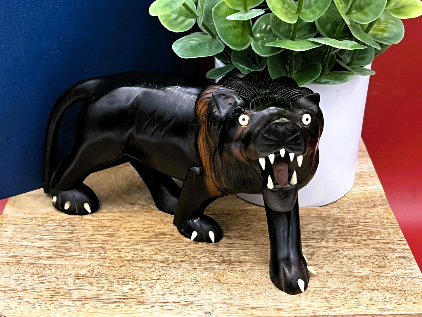 Hand-Carved Ebony Lion Sculpture with Bone Accents 7-Inch Art Decor