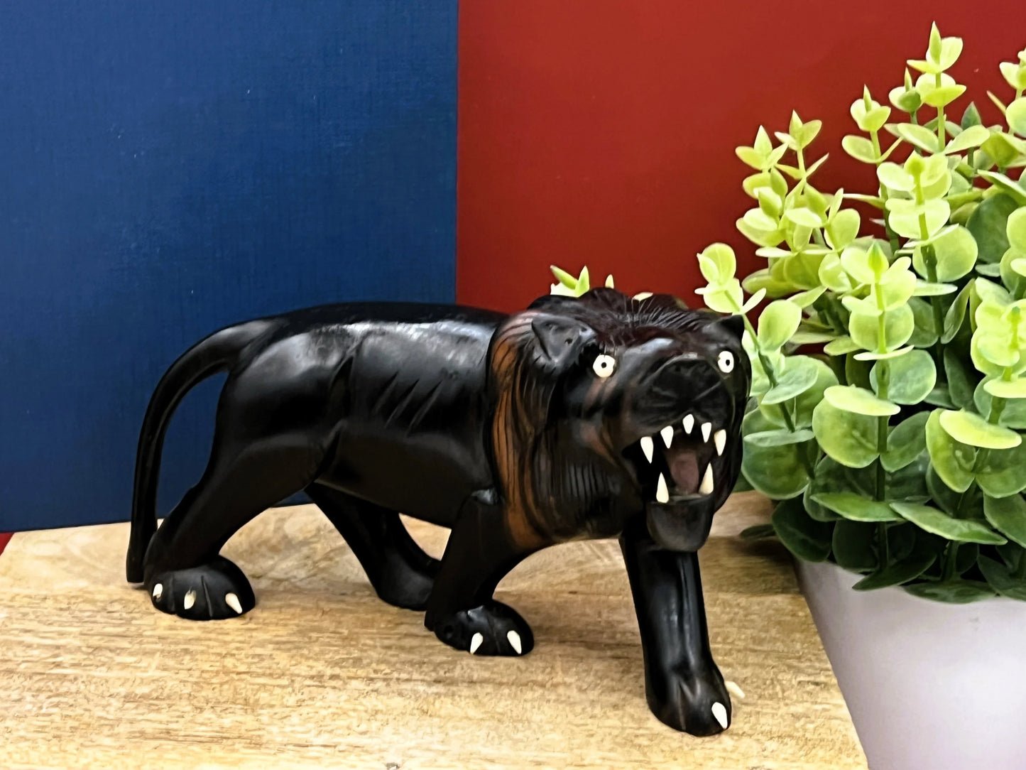 Hand-Carved Ebony Lion Sculpture with Bone Accents 7-Inch Art Decor