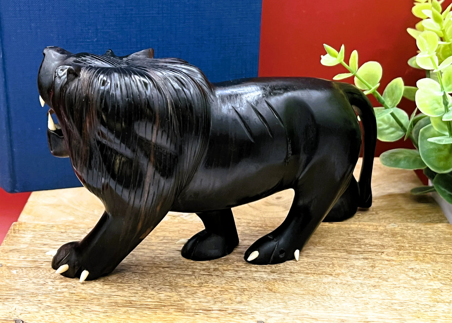 Hand-Carved Ebony Lion Sculpture with Bone Accents 7-Inch Art Decor