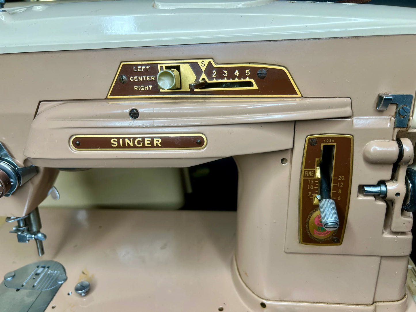 Control panel on a vintage Singer 403A Slant-o-Matic sewing machine