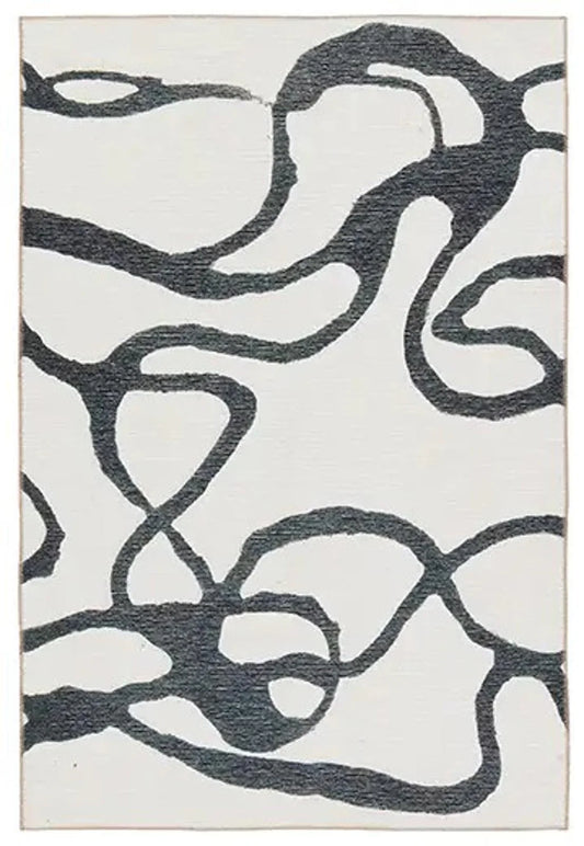 Abstract patterned rug with black and white design