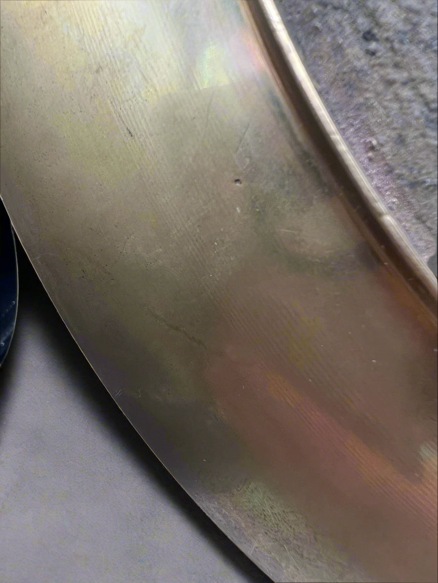 Close-up of a metallic surface with reflections