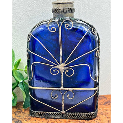 Blue Glass Perfume Bottle with Ornate Silver Design