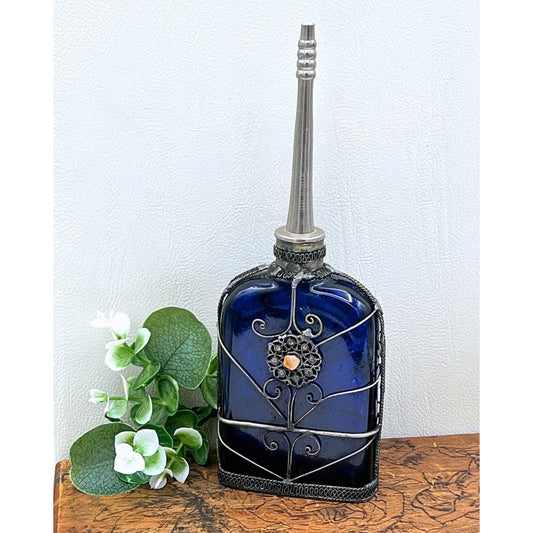 Blue Glass Perfume Bottle with Ornate Silver Design