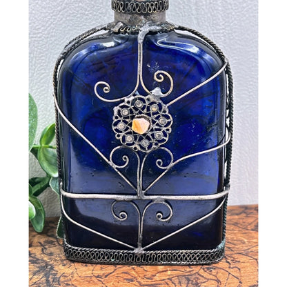 Blue Glass Perfume Bottle with Ornate Silver Design