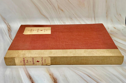 Gilt title on the spine of the 1904 The Golden Ass of Apuleius, showing the vellum binding and raised bands.