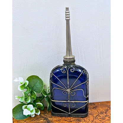 Blue Glass Perfume Bottle with Ornate Silver Design