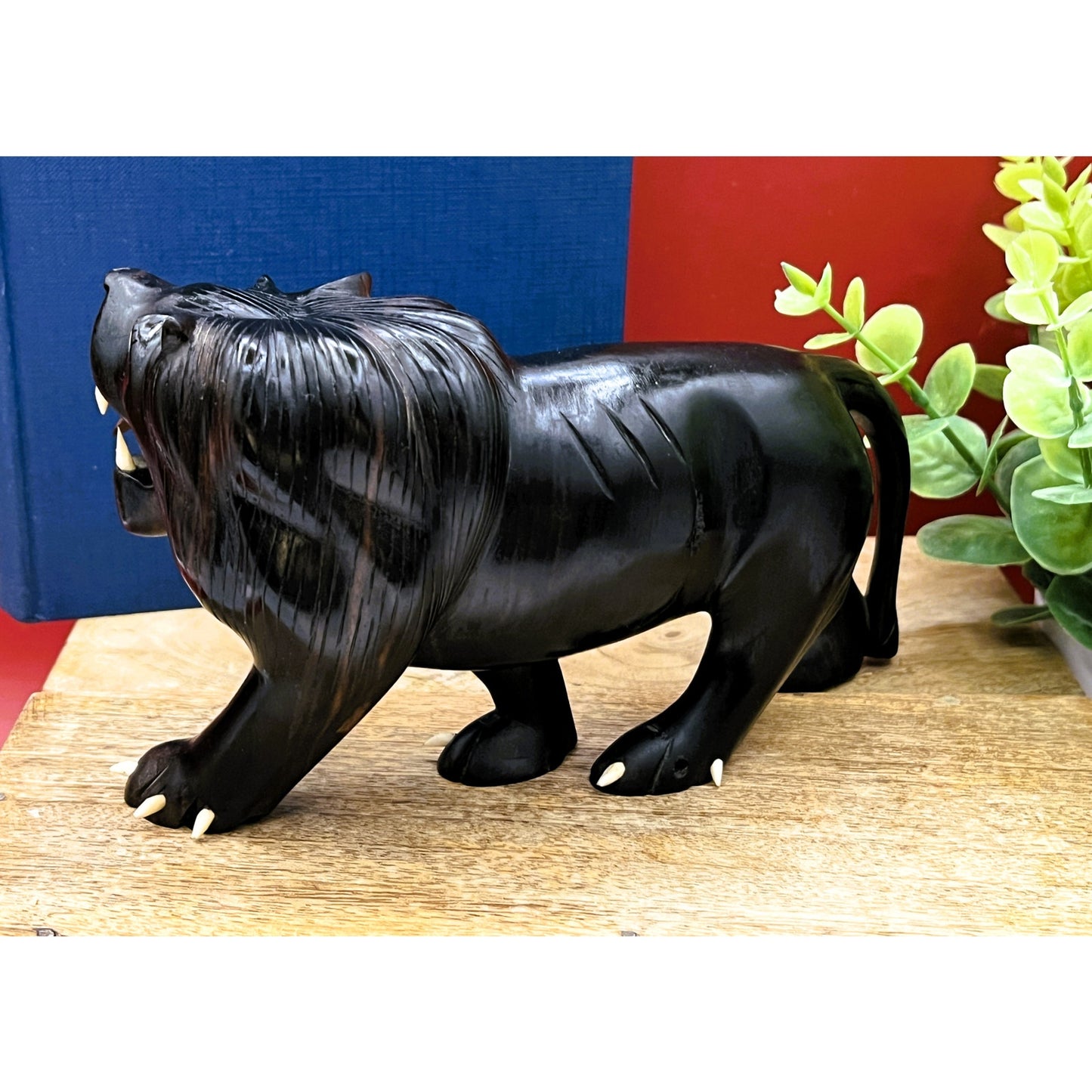 Hand-Carved Ebony Lion Sculpture with Bone Accents 7-Inch Art Decor