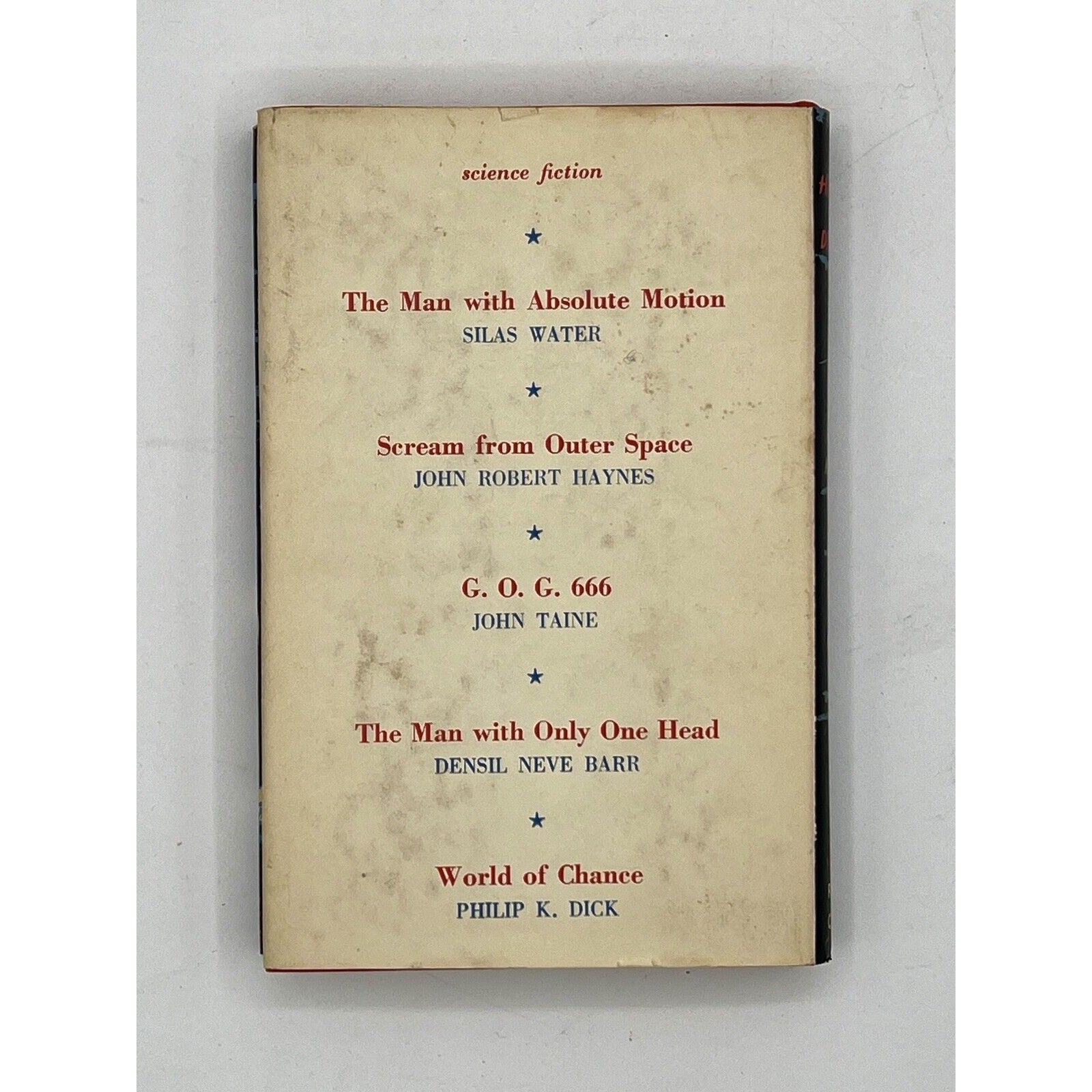 Book with a beige cover featuring text of science fiction titles and authors on a white background