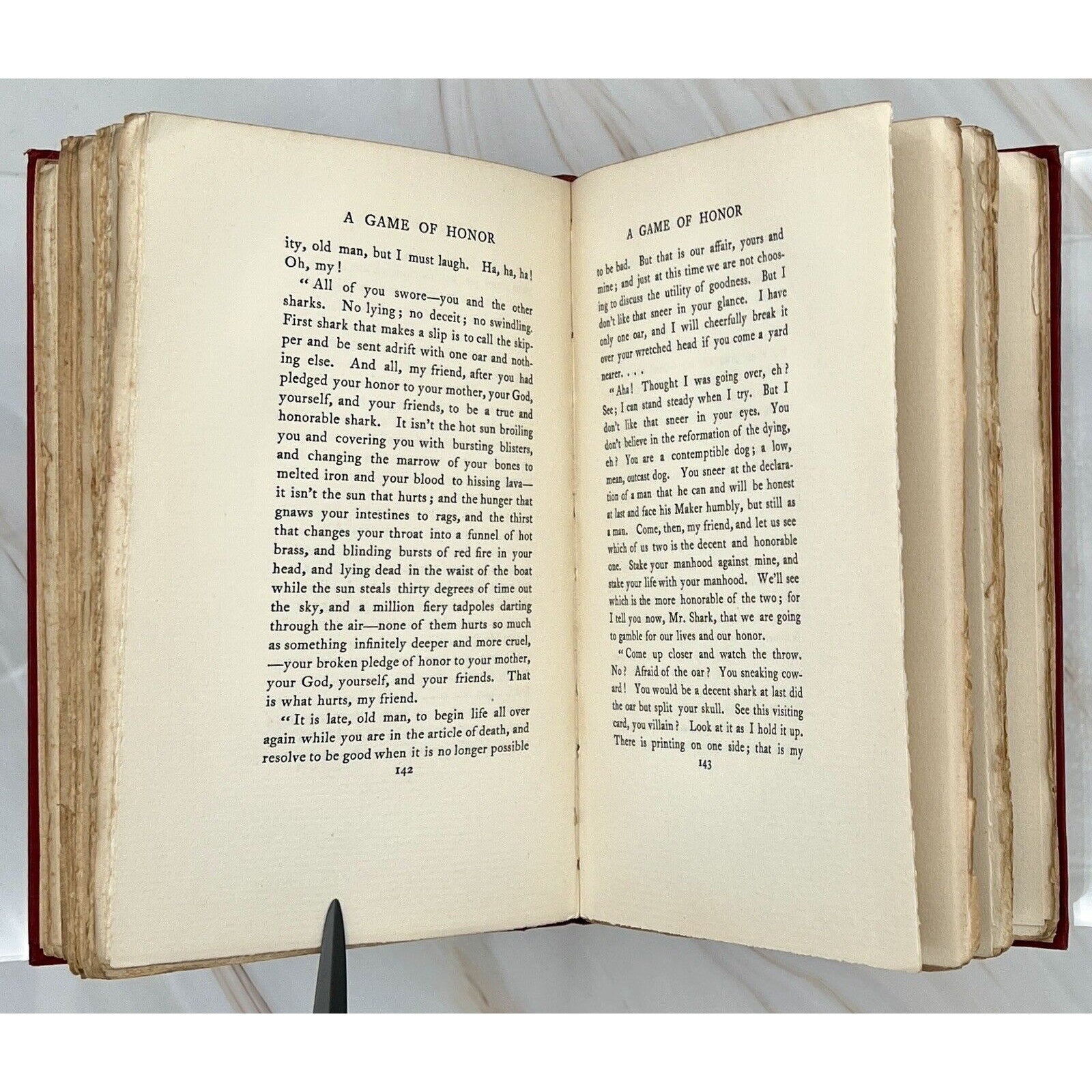 Open 1897 first edition of The Ape, The Idiot & Other People by W. C. Morrow, pages show 'A Game of Honor'.