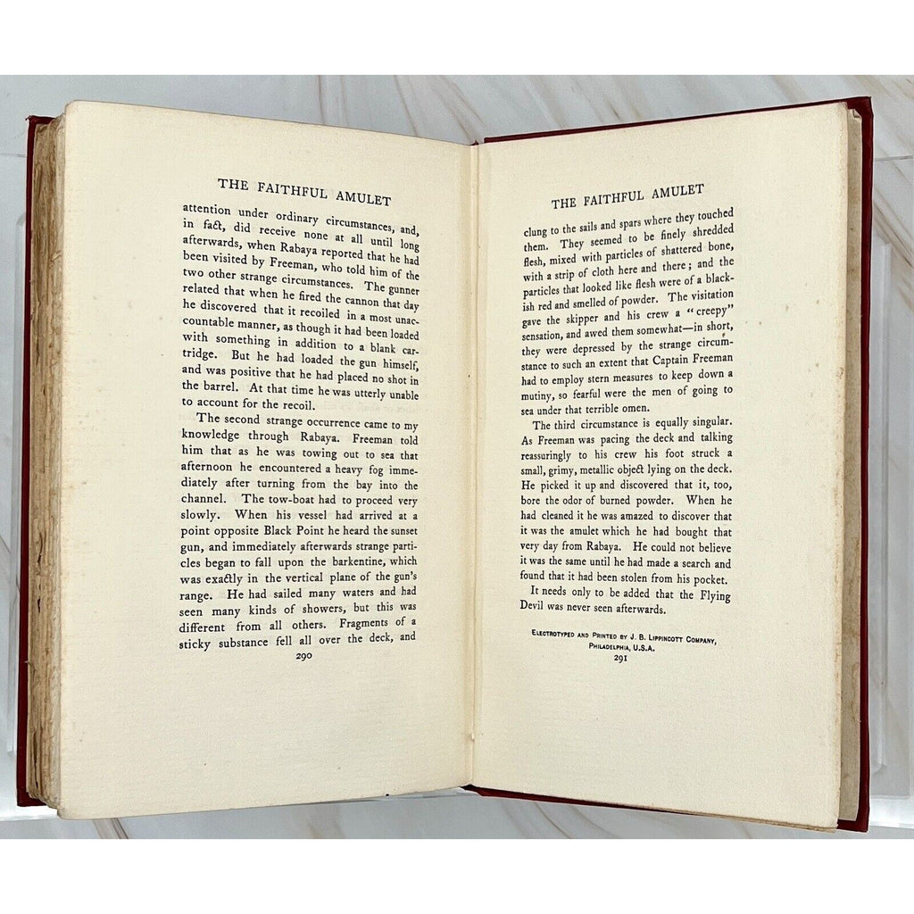 Open first edition 1897 of The Ape, The Idiot & Other People by W. C. Morrow; pages show The Faithful Amulet.