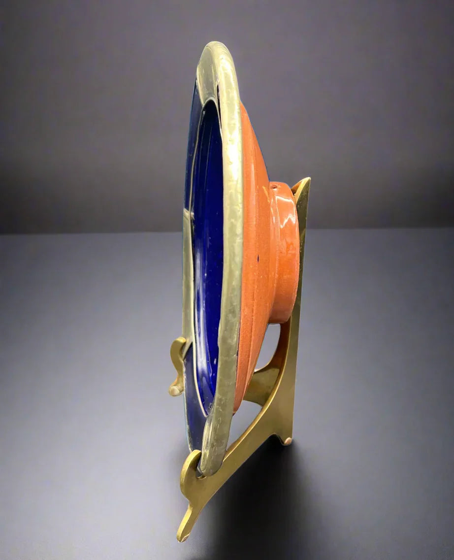 Colorful spool on a stand against a white background