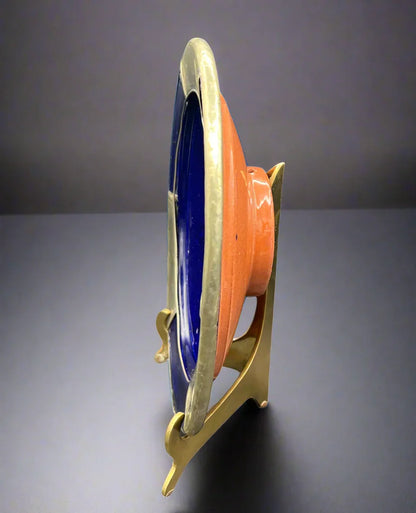 Colorful spool on a stand against a white background